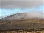 The summit of Snaefell peeking through the mist - (23/11/03)